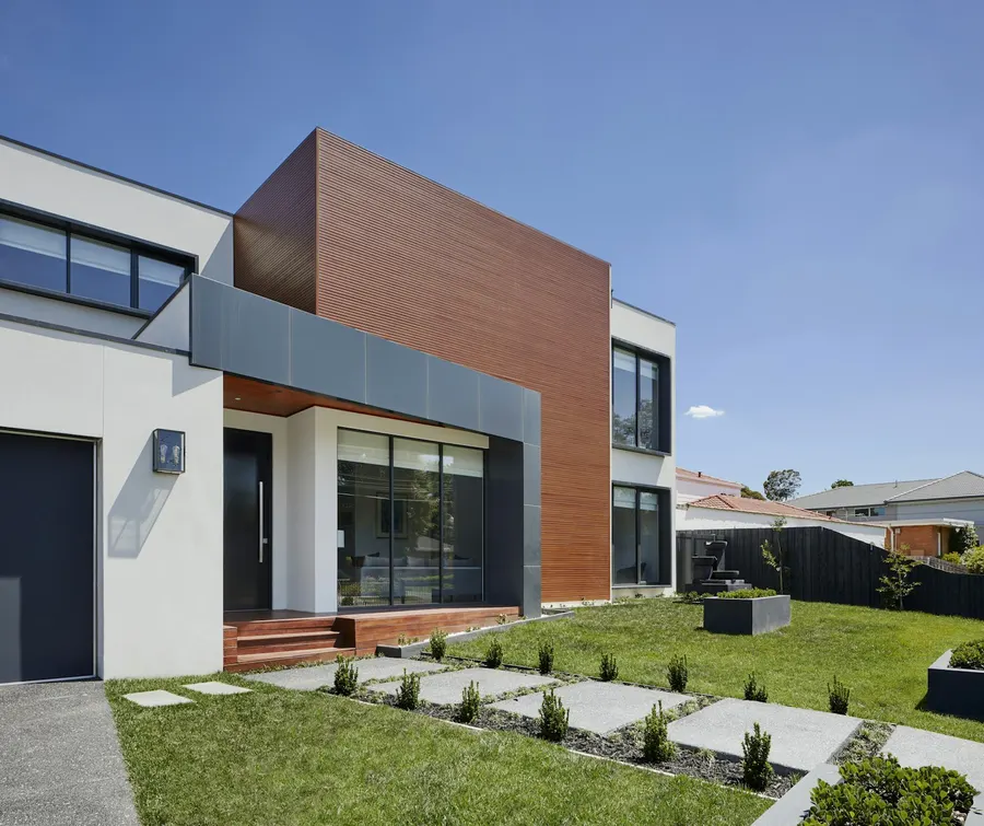 Contemporary house with white and wood-clad exterior